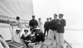 1411-King Alfonso's party aboard Shamrock. Sir Thomas Lipton and Queen of Spain in shot. c1910.