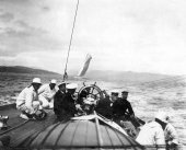 1570-View of helm of Shamrock with Sir Thomas Lipton and crew. c1900.