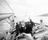 1573-View of helm and deck of Shamrock with Sir Thomas Lipton and crew. c1900.