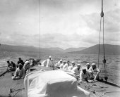 1578-View of crew seated on Shamrock's decks. c1900.