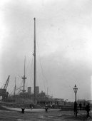 702-New mast stopped at James Watt Docks, Greenock. Shamrock III. HMS Benboco seen in adjoining dock. April 1903.