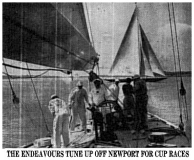 THE ENDEAVOURS TUNE UP OFF NEWPORT FOR CUP RACES - Captain D. H. Williams at wheel of Endeavour II as she gets under way on Narragansett Bay. Above to the left is the big English Park Avenue boom on the British sloop. In the background the first Endeavour, which in 1934 was defeated for the mug, is seen under full sail. 